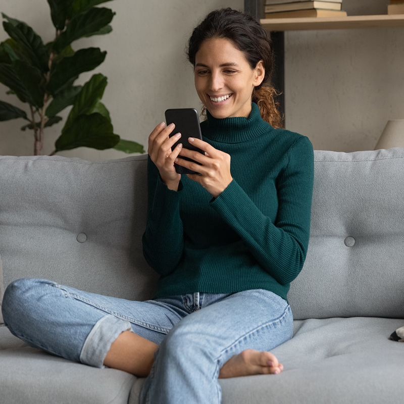 Woman checking insurance coverage on her mobile phone